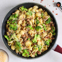 Sausage and broccoli pasta recipe in a skillet.