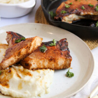 Brown sugar pork chops on a plate.