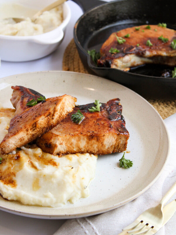 Brown sugar pork chops on a plate.