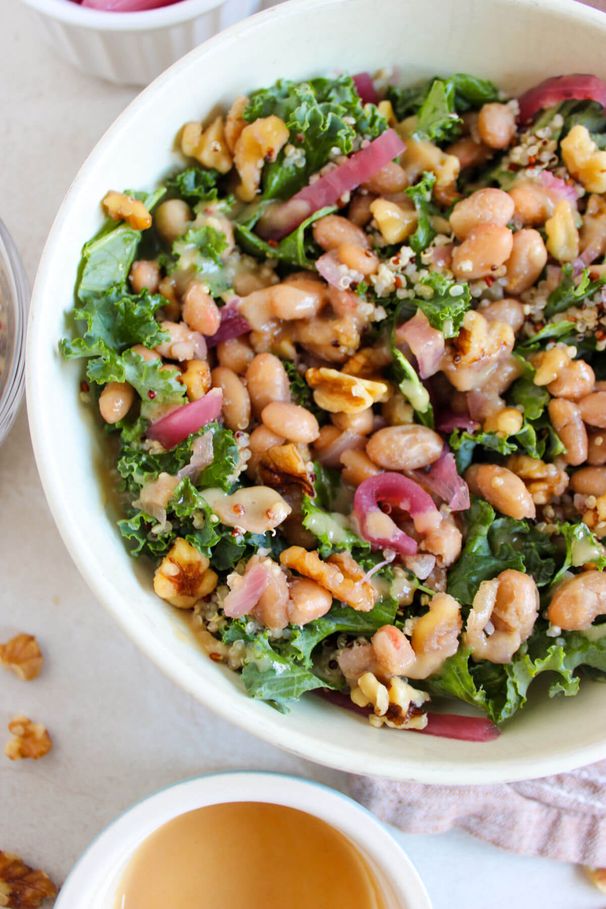 Butter bean salad in a white bowl.
