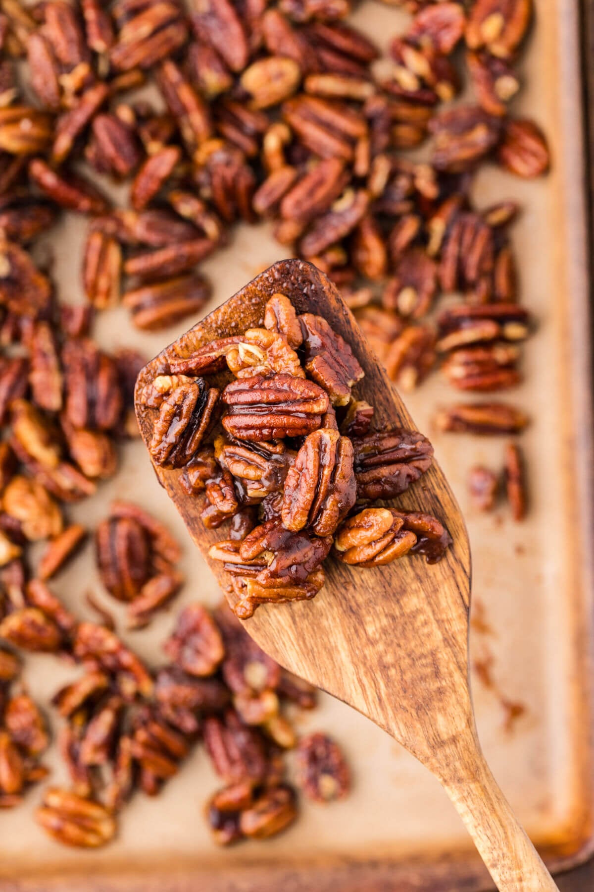 Stirring candied maple pecans.