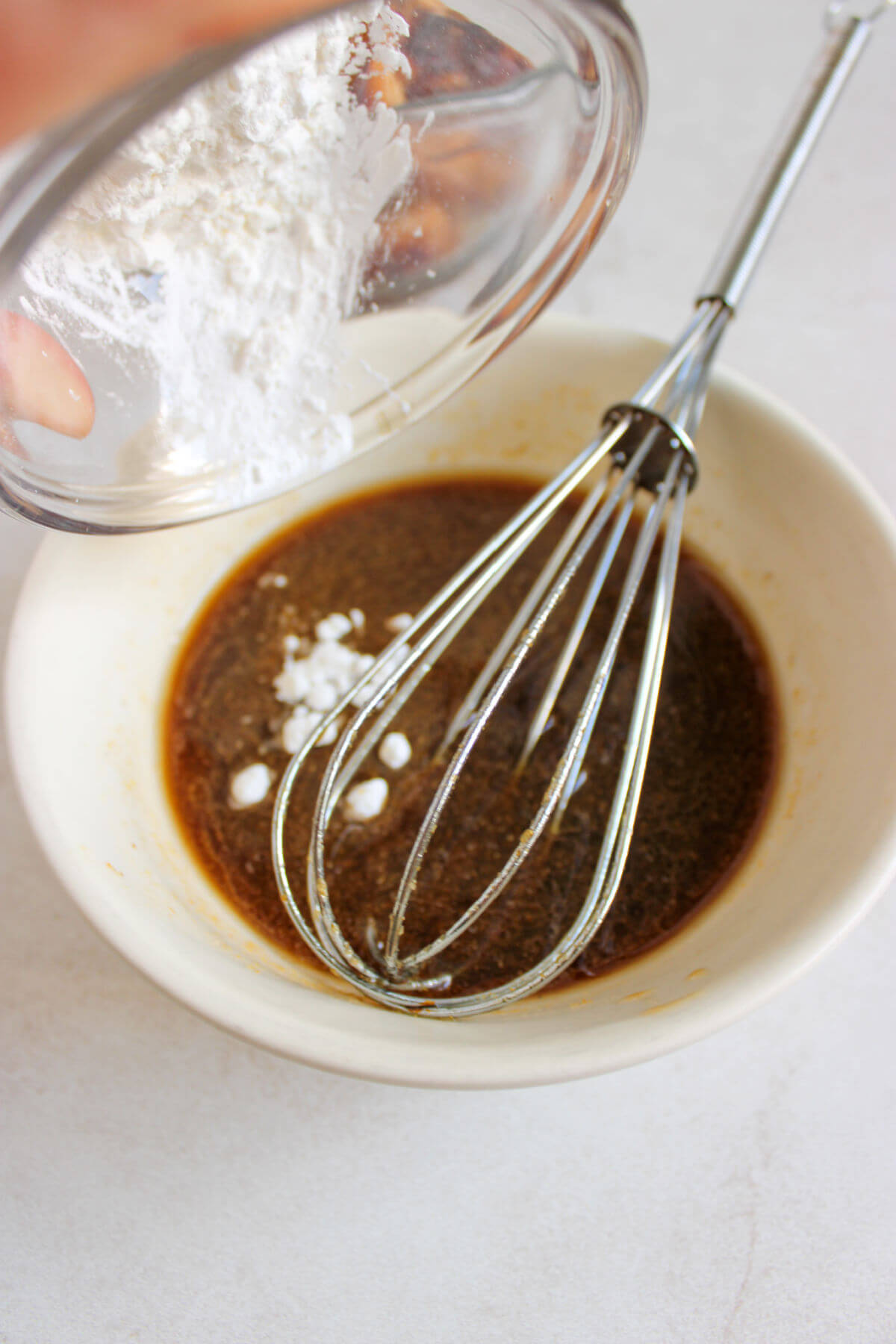 Making the sauce in a small bowl.