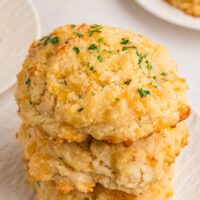 A stack of three cheesy drop biscuits.