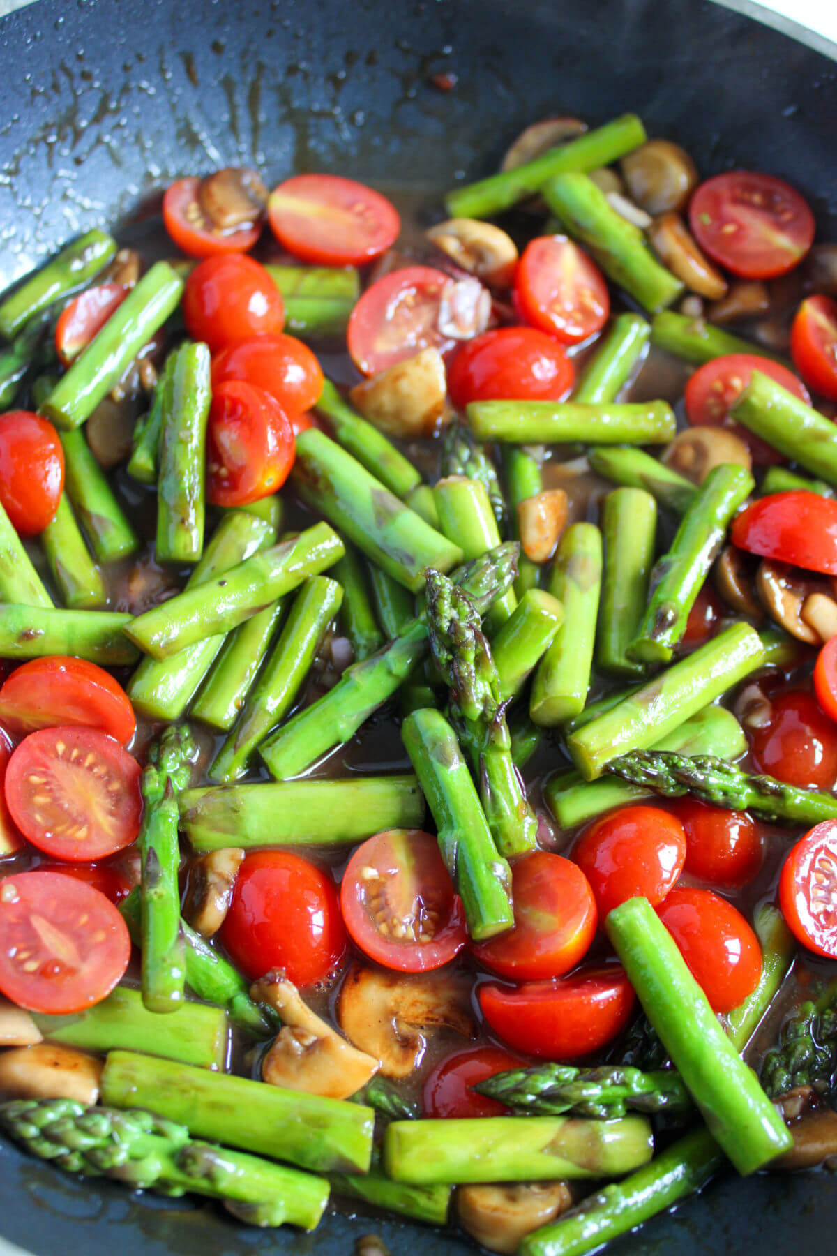 Cooking vegetables in a skillet for one pan chicken and vegetables.