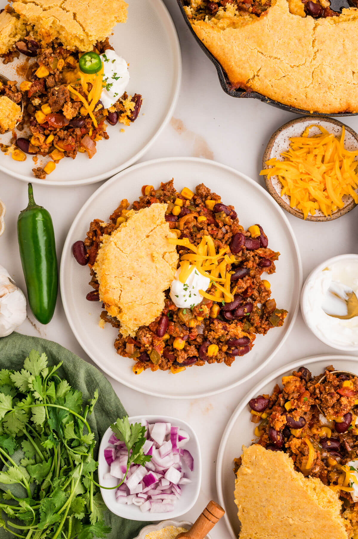Chili cornbread casserole on plates.