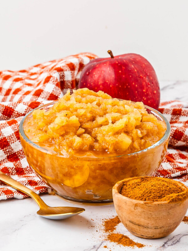 Homemade applesauce in a clear bowl.
