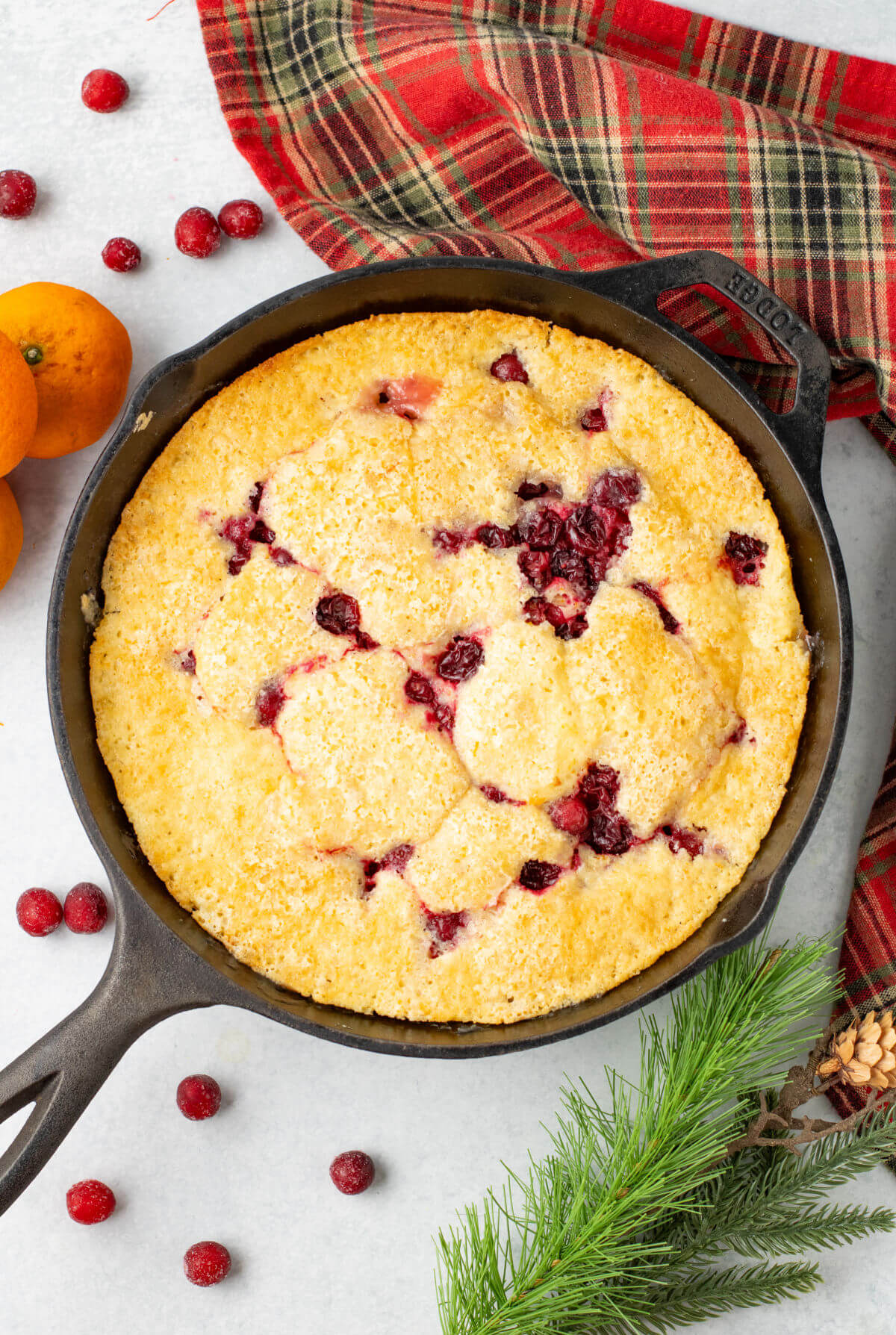 Cranberry orange cobbler in a cast iron skillet.