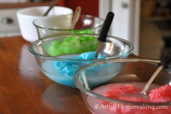 bowls containing silks being dyed in Kool-Aid to make playsilks