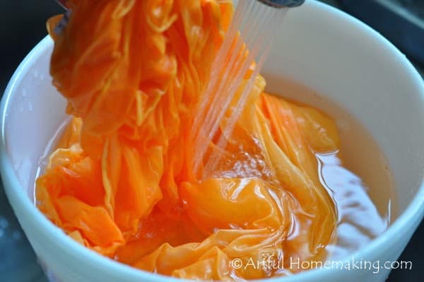 A homemade orange dyed playsilk
