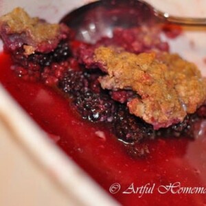 a serving of homemade blackberry cobbler made with whole wheat flour.