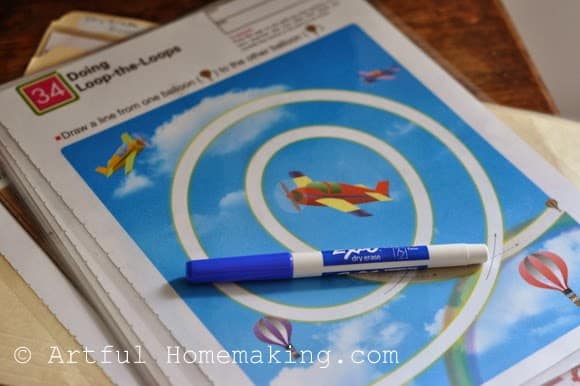 laminated Kumon worksheets with dry erase marker