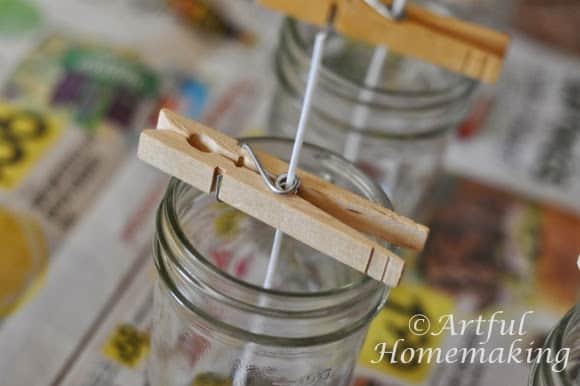 clothespins and wicks used to make homemade soy candles