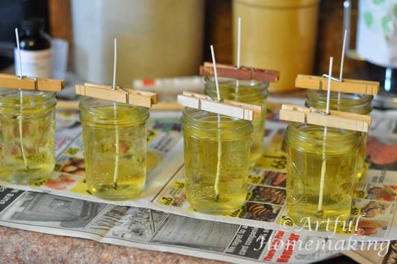 melted soy wax in glass jars used to make homemade soy candles