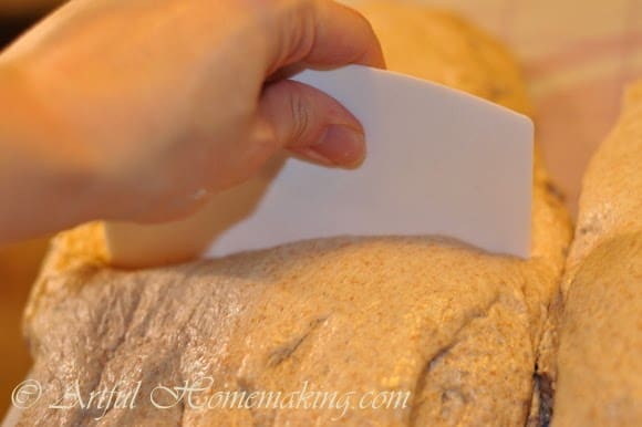 cutting pizza dough