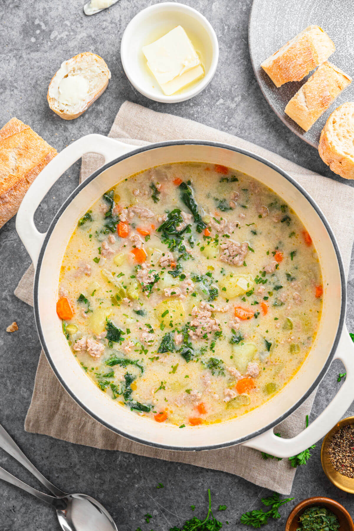 a Dutch oven containing sausage kale potato soup