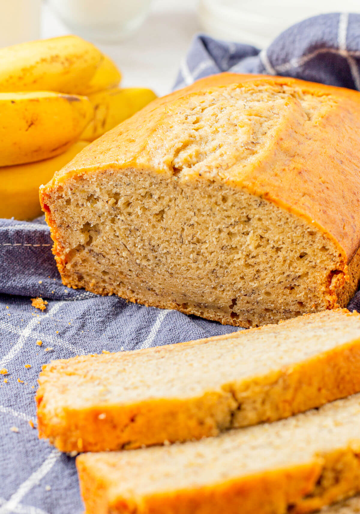 Loaf of quick and easy banana bread with a couple of slices cut off.