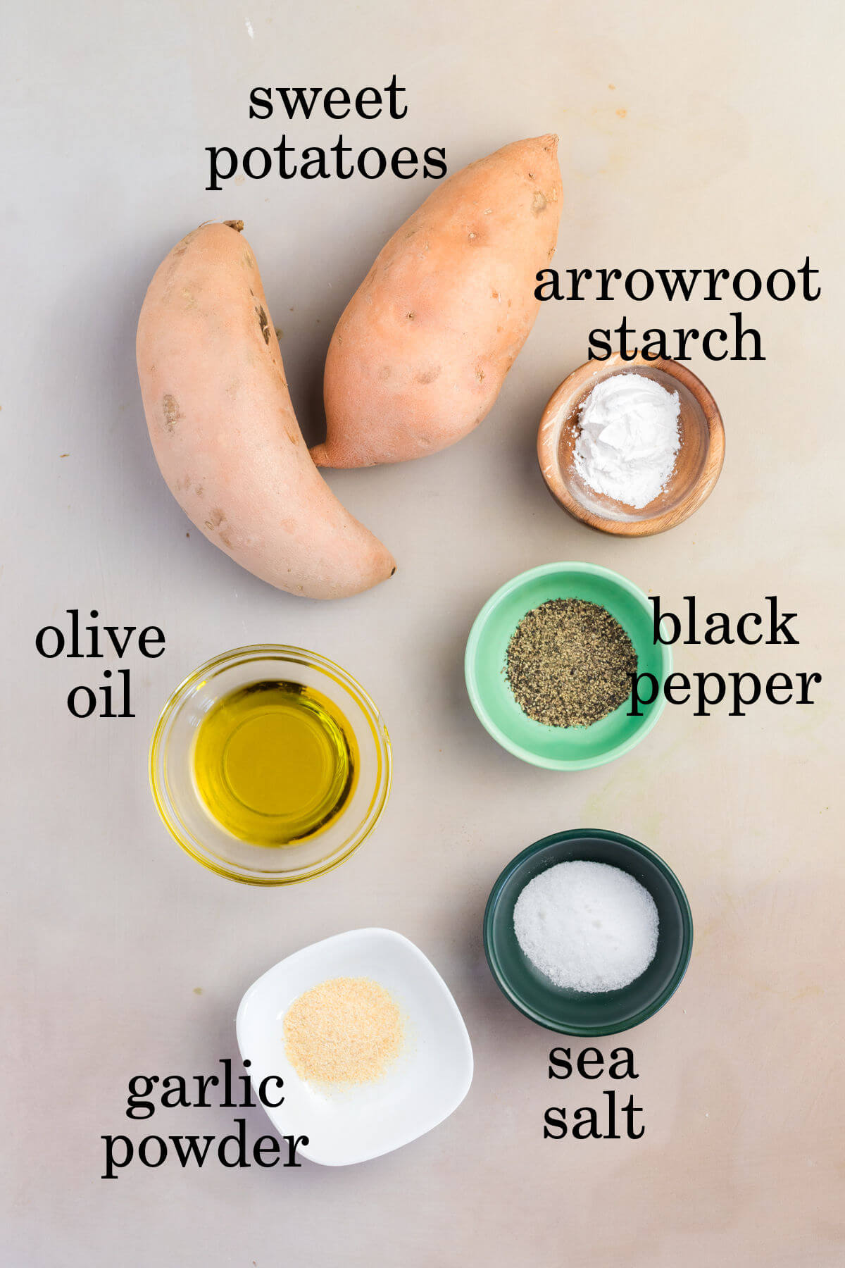 Ingredients for crispy sweet potato fries in small bowls.