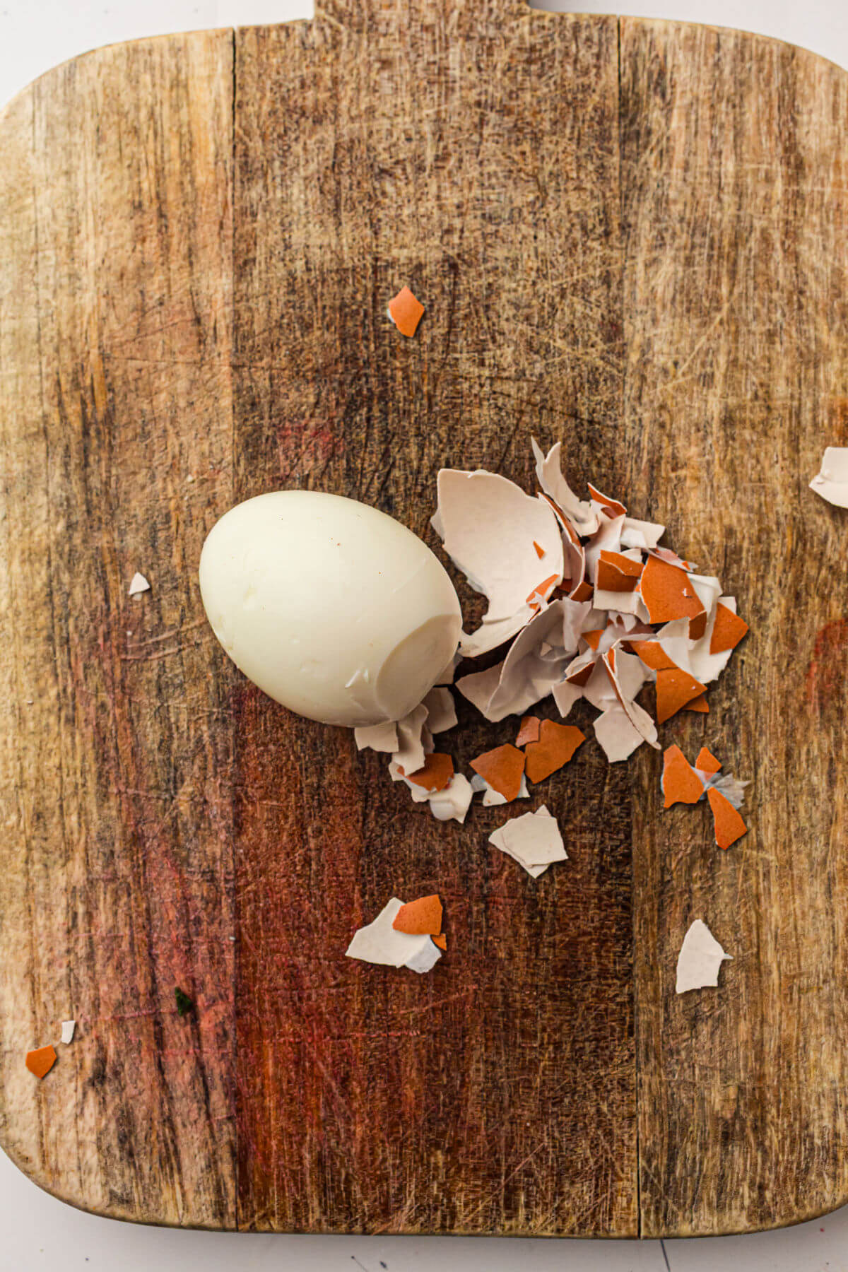 Peeling hard boiled eggs for deviled eggs recipe.