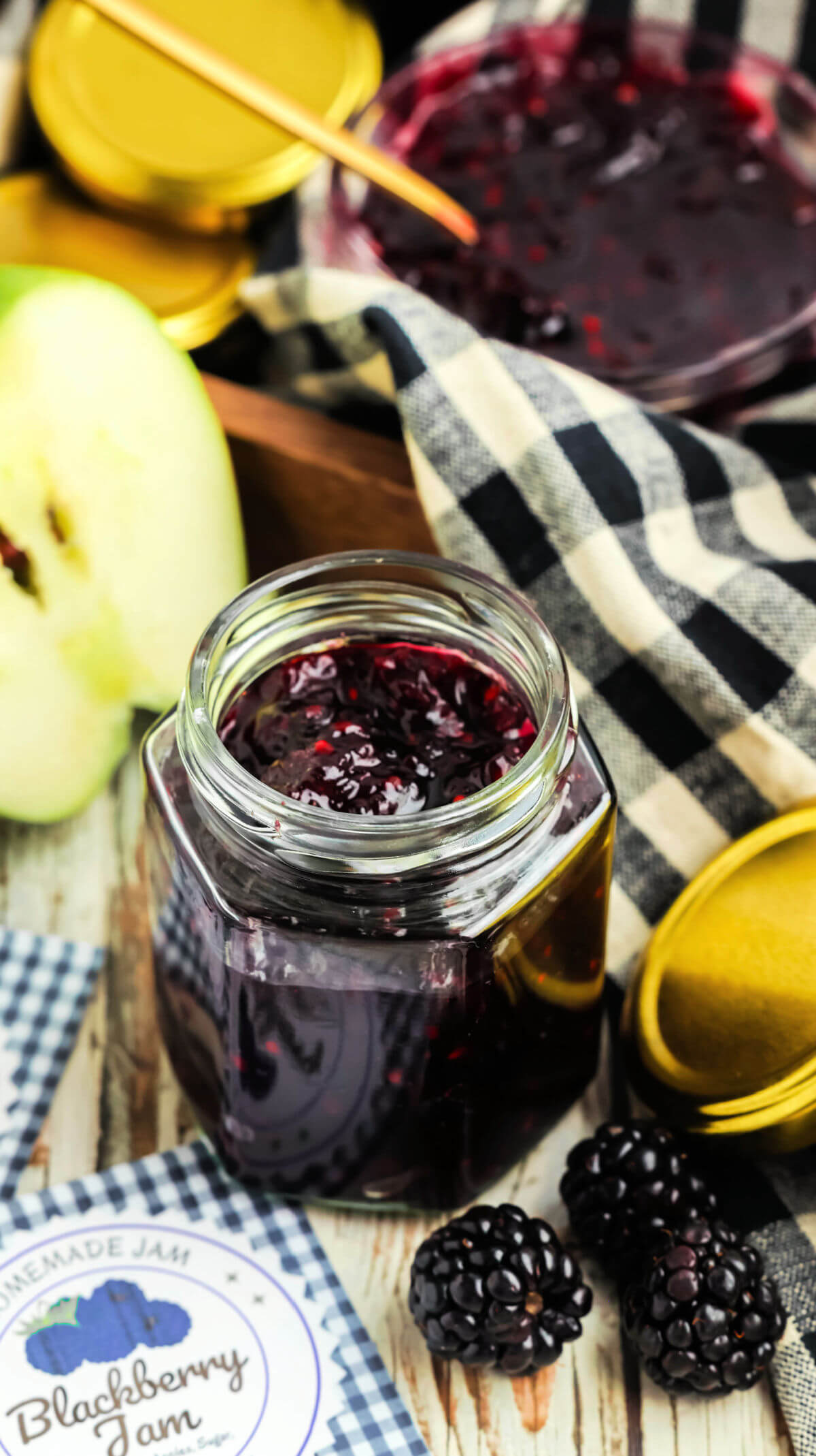 Ladling blackberry jam without pectin into jars.