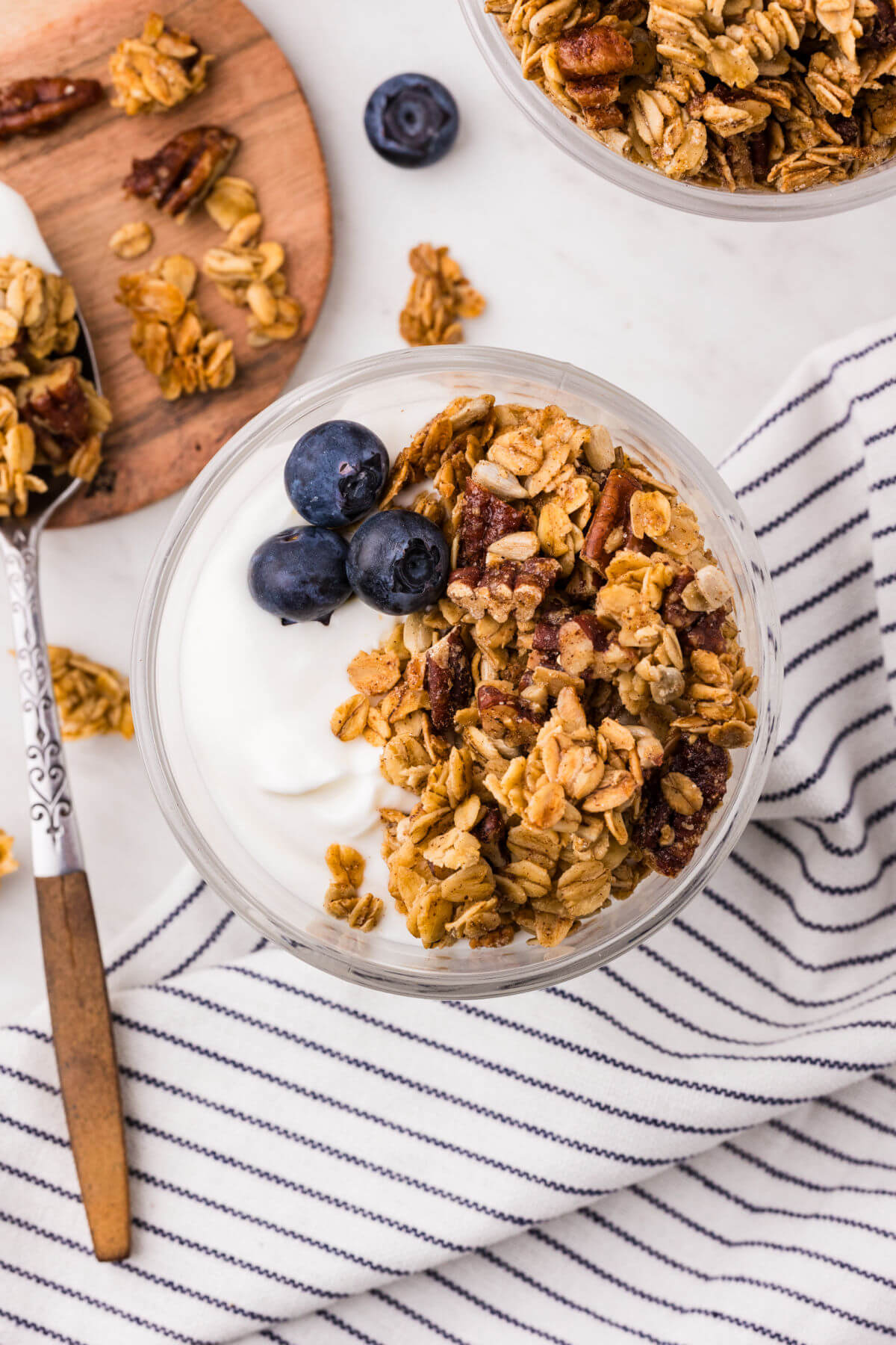 Maple granola on top of yogurt with blueberries.