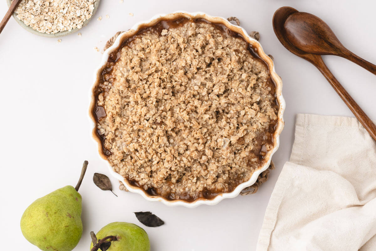 Pear crisp in a round baking dish.