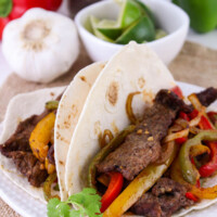 Sheet pan beef fajitas on a plate.