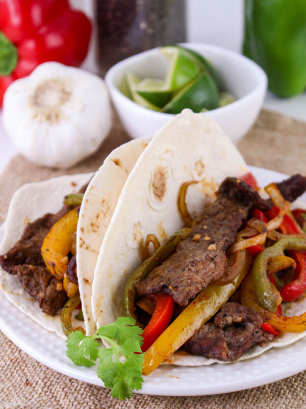 Sheet pan beef fajitas on a plate.