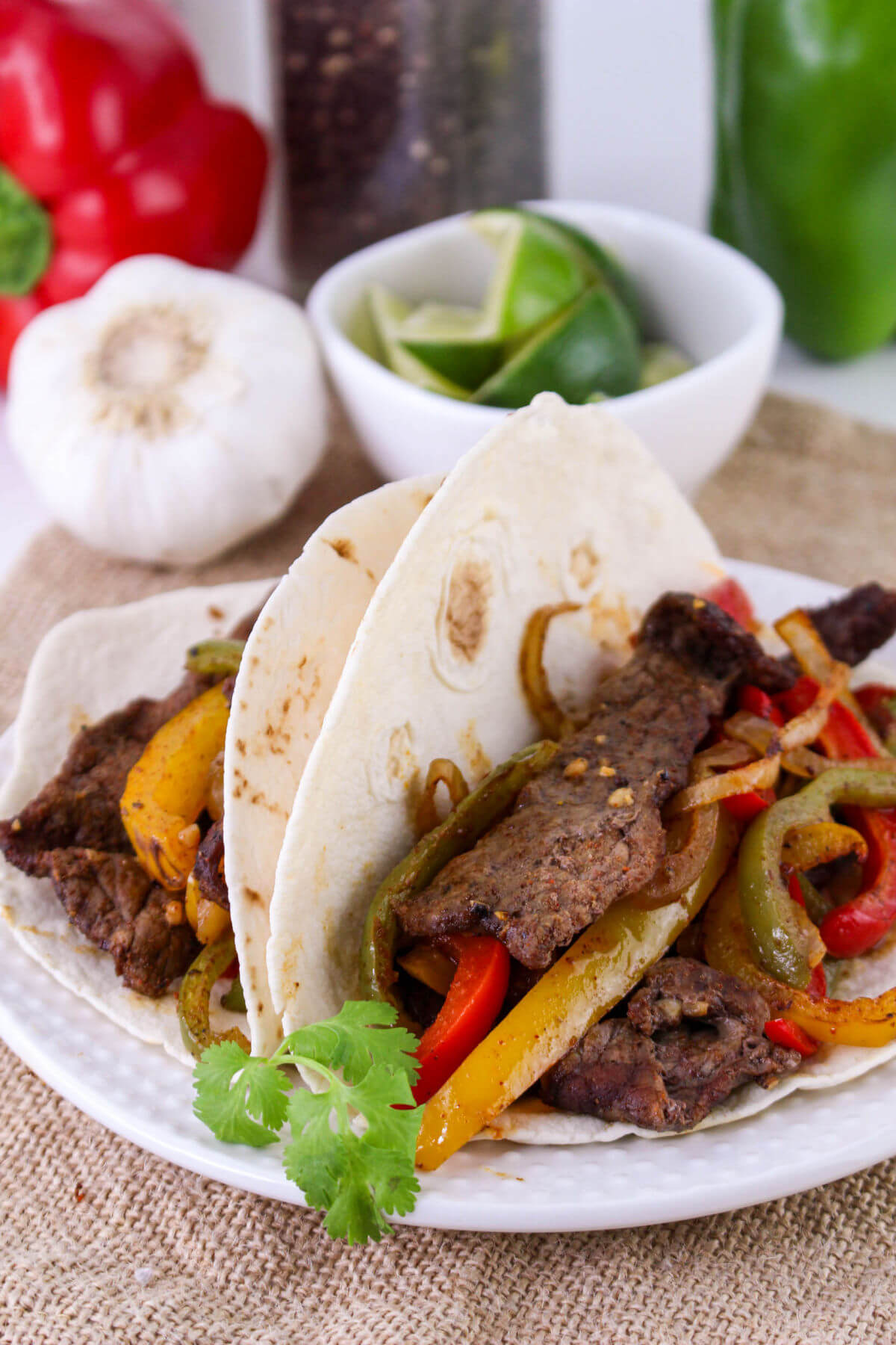 Sheet pan beef fajitas on a plate.