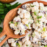 Wooden bowl of turkey salad.