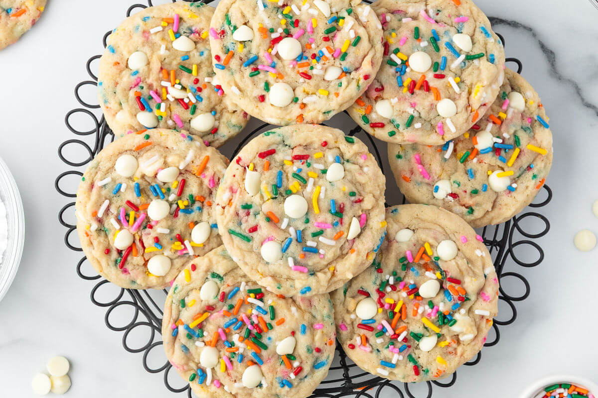 Sourdough Funfetti cookies on a wire cooking rack.