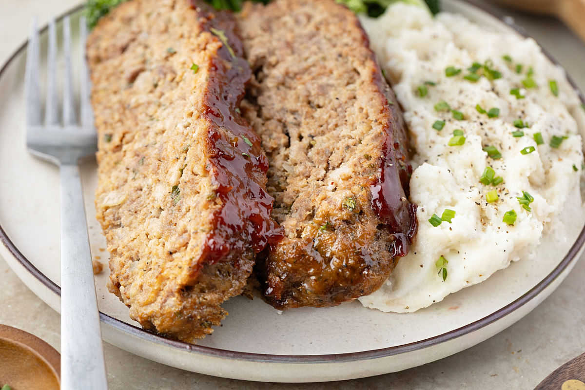 Glazed meatloaf with mashed potatoes.