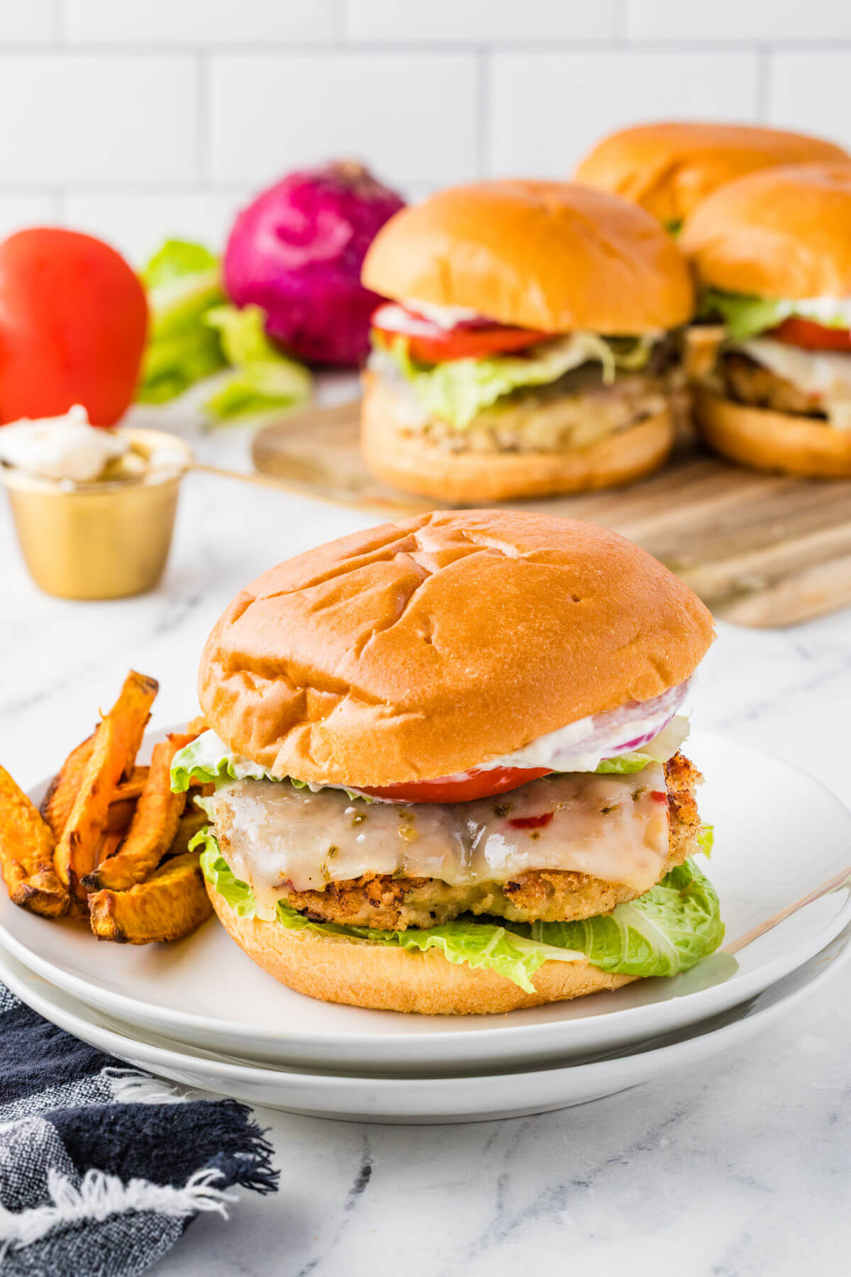 Chicken burgers on a plate for serving.