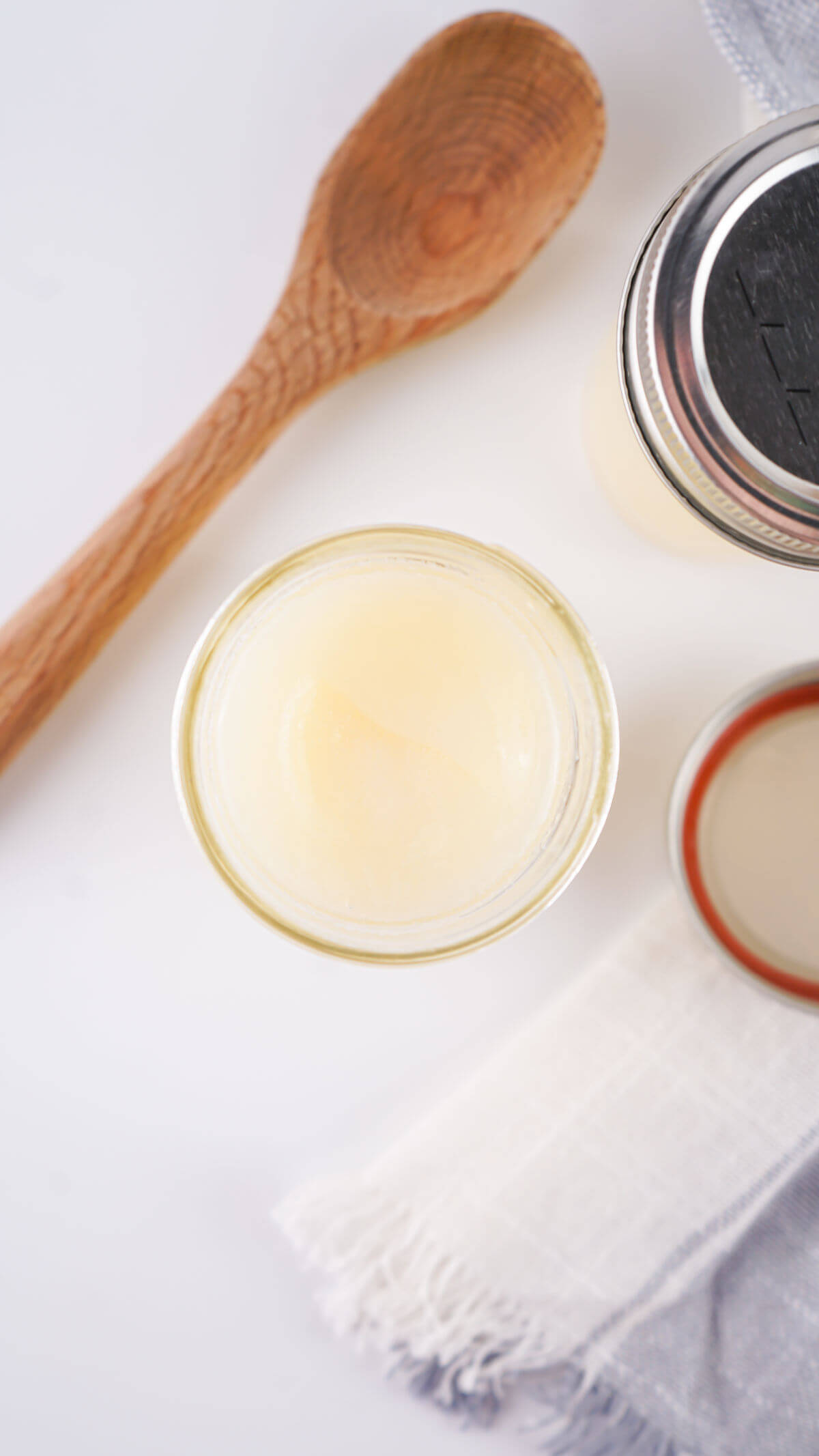 Homemade beef tallow in a glass mason jar.