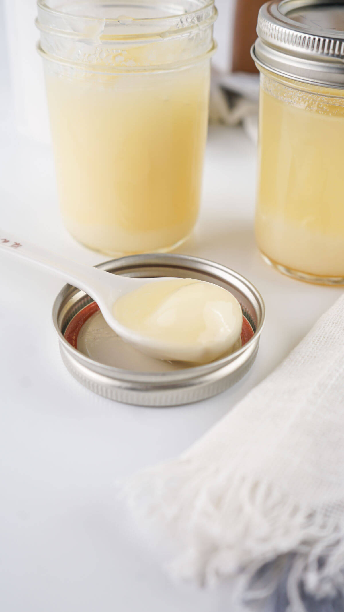 Homemade beef tallow in glass jars.
