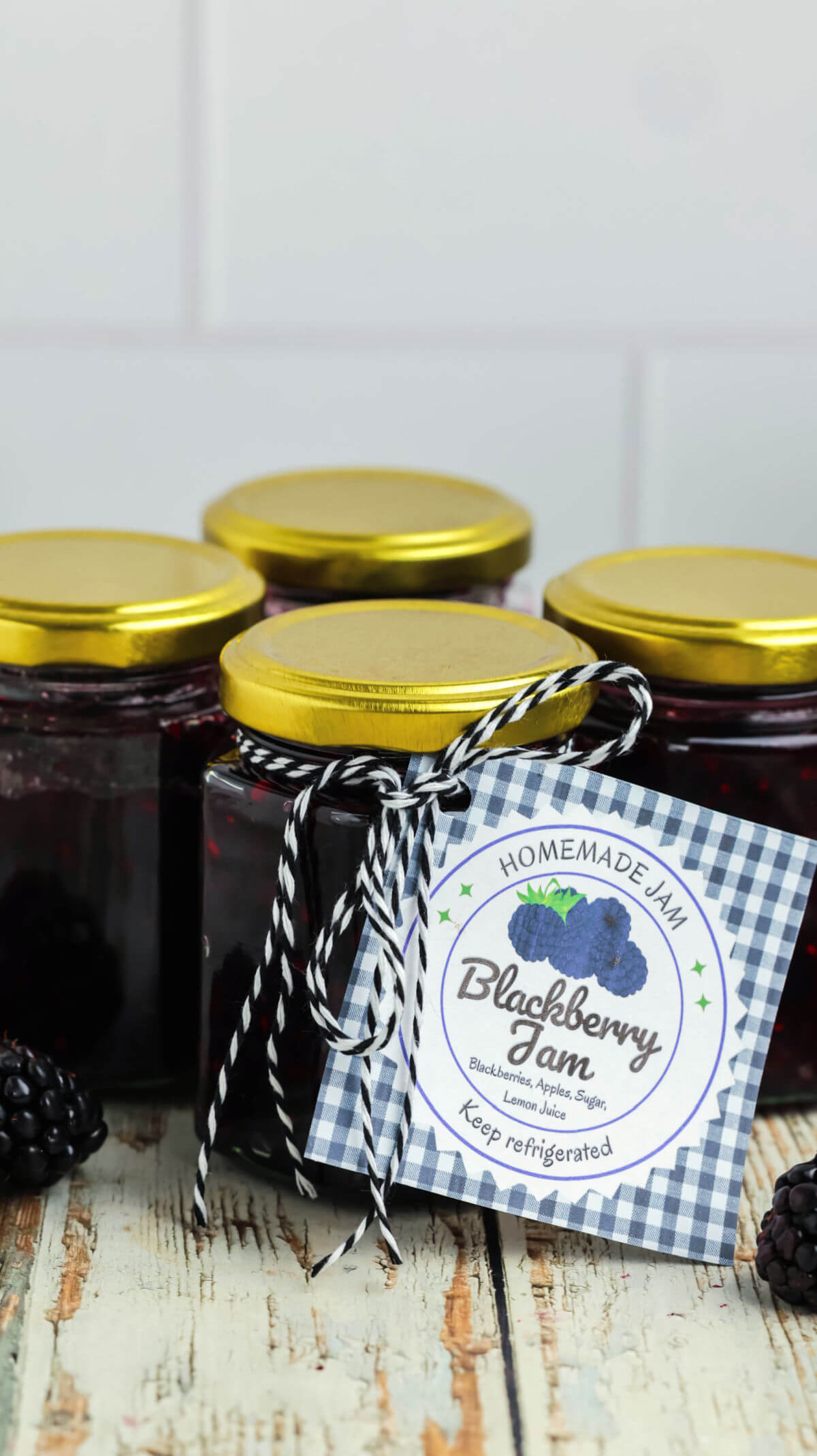 Jars filled with blackberry jam.