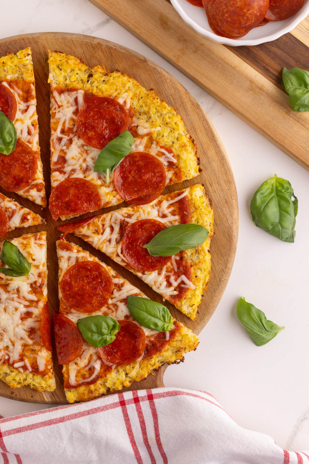 Sliced cauliflower pizza crust.