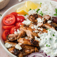 Greek chicken bowl with tzatziki sauce in a bowl for serving.