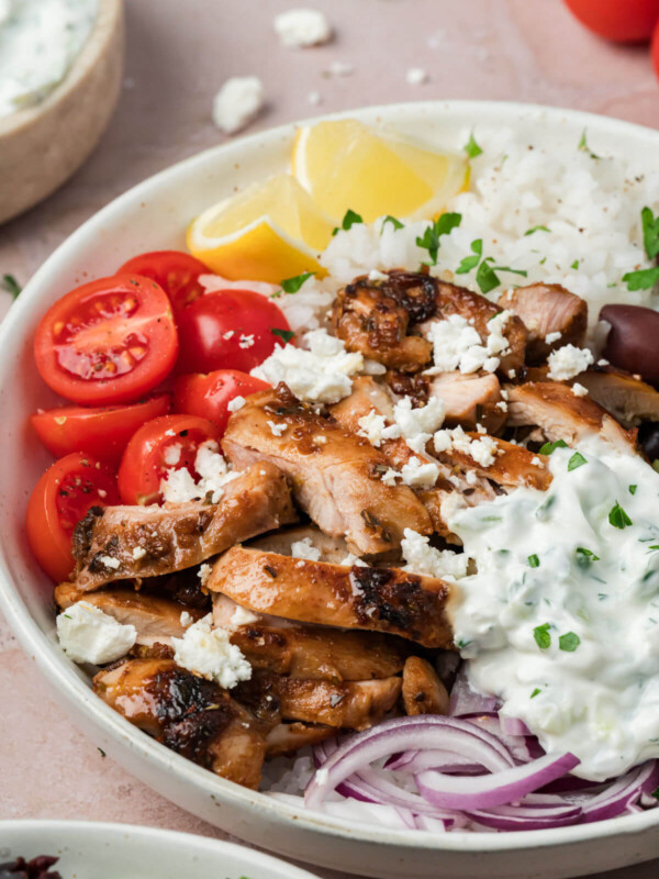 Greek chicken bowl with tzatziki sauce in a bowl for serving.