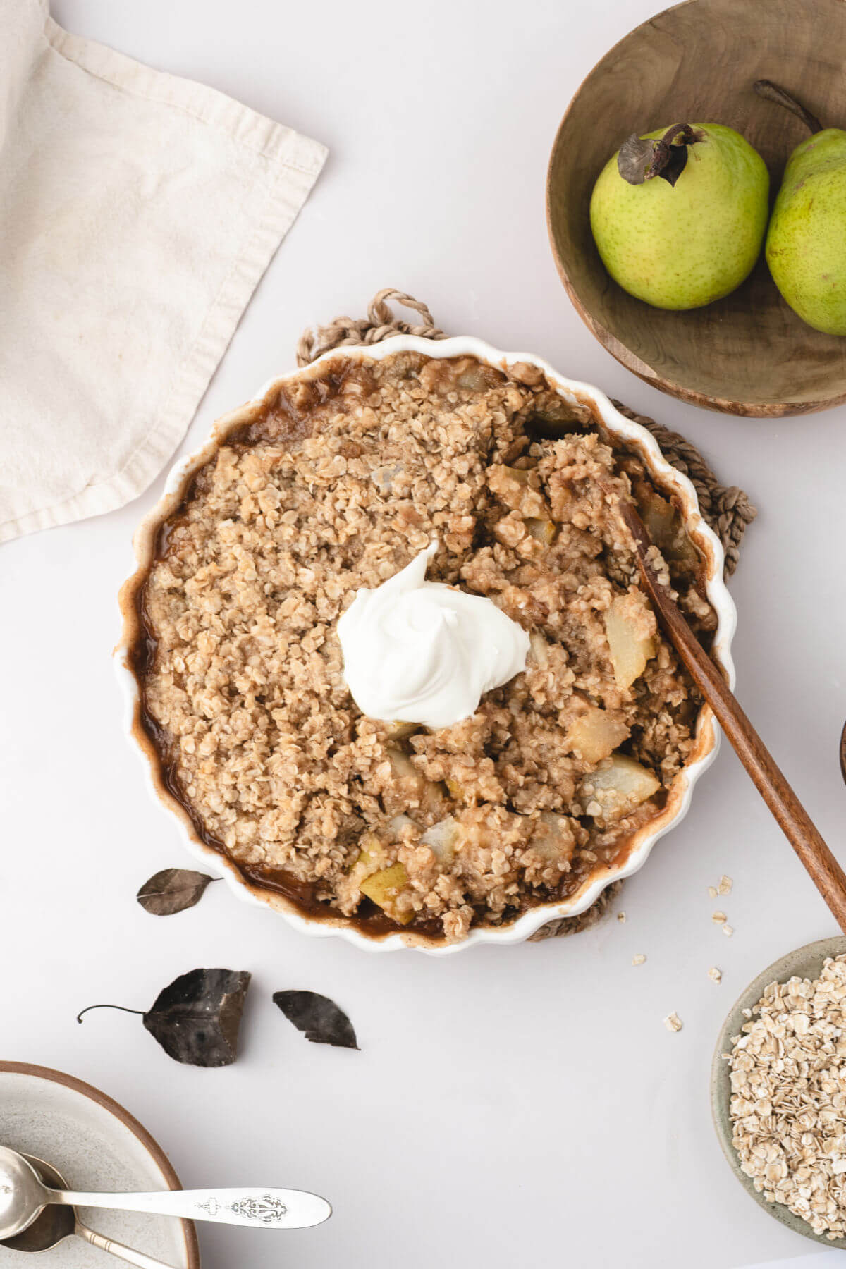 Pear crisp with whipped cream on top.