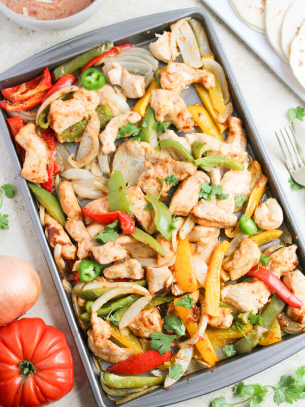 Easy sheet pan chicken fajitas on a sheet pan.