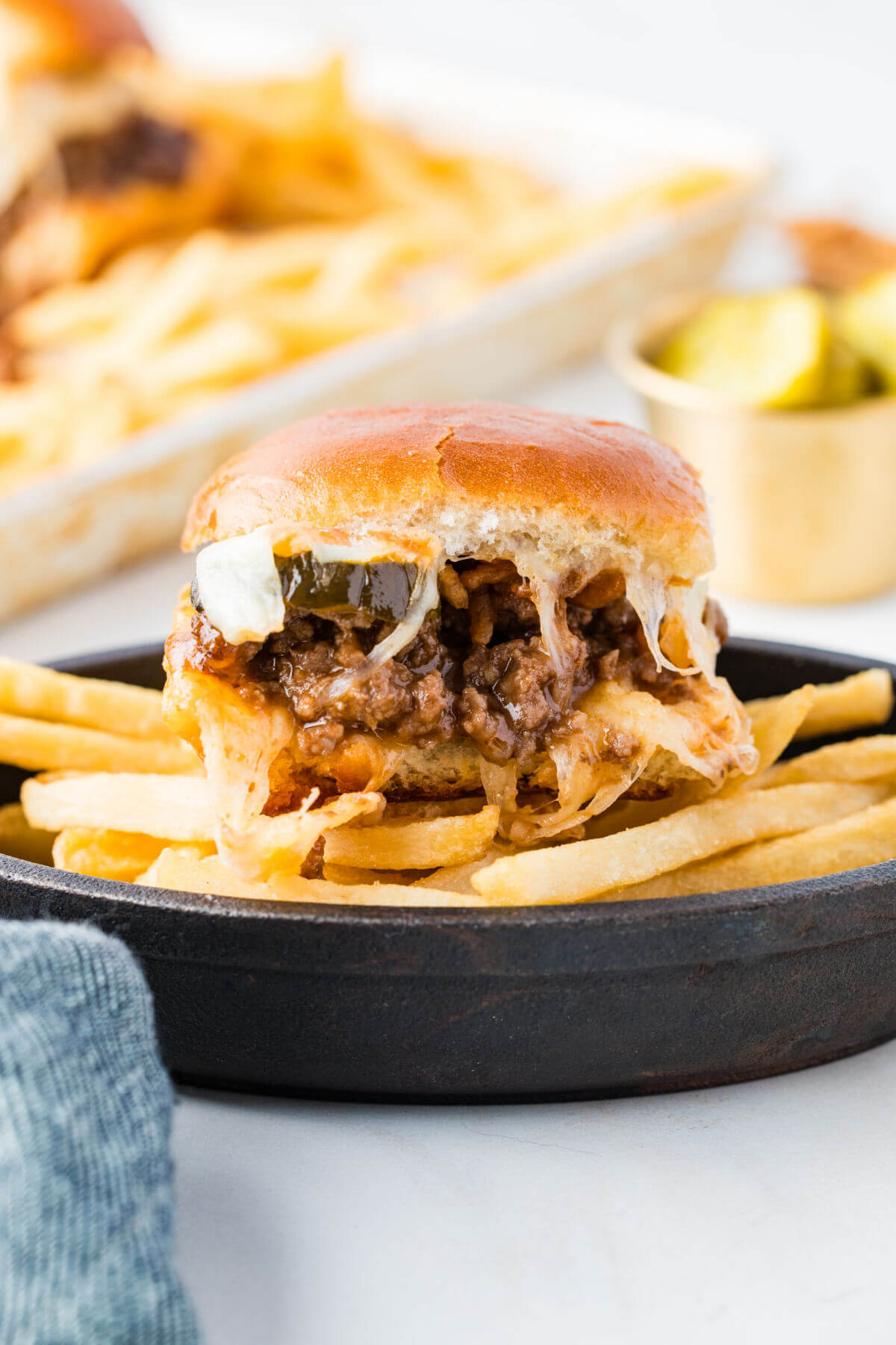 Sloppy joe sliders on a serving plate.