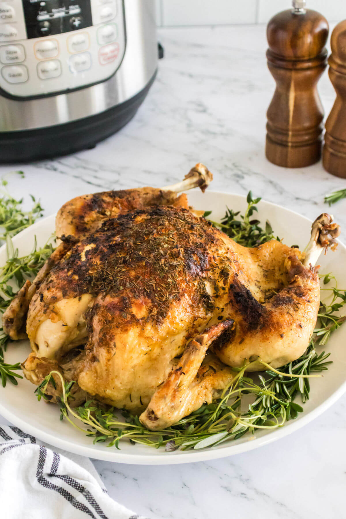 Instant Pot whole chicken on a plate.