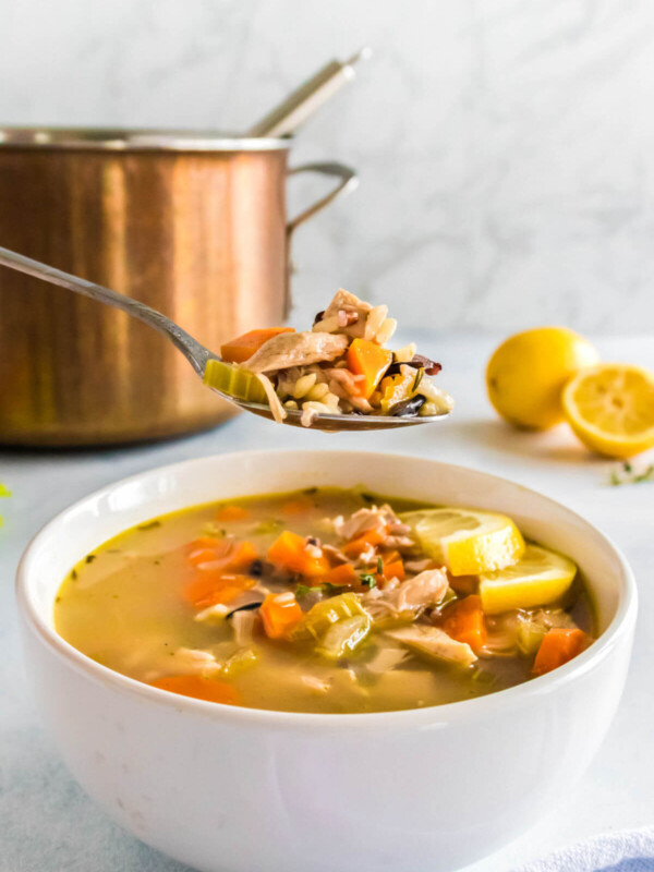 A bowl of lemon chicken rice soup.
