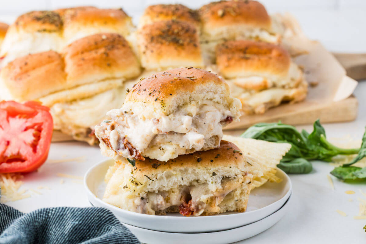 Baked marry me chicken sliders on serving plates.