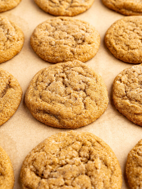 Chewy molasses cookies on a cookie sheet after baking.