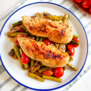 One pan chicken and vegetables on a plate for serving.