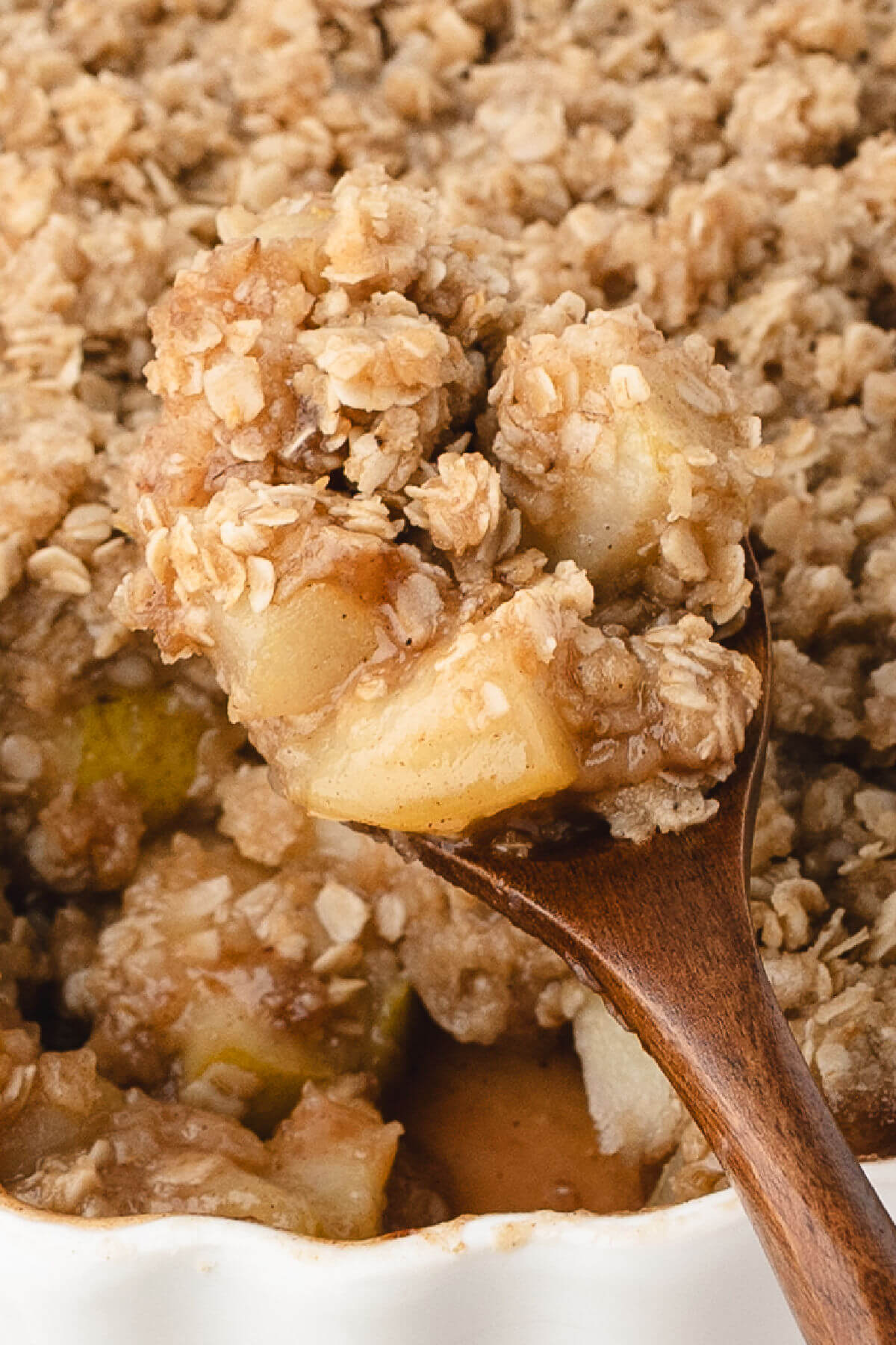 Pear crisp in a white baking dish.
