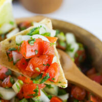 Homemade Pico de Gallo on a corn tortilla chip.