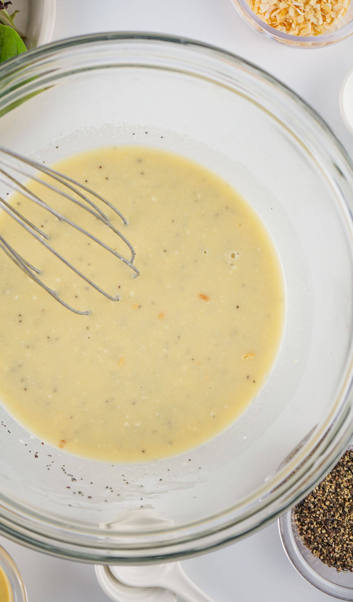 Mixing ingredients for homemade poppy seed dressing.