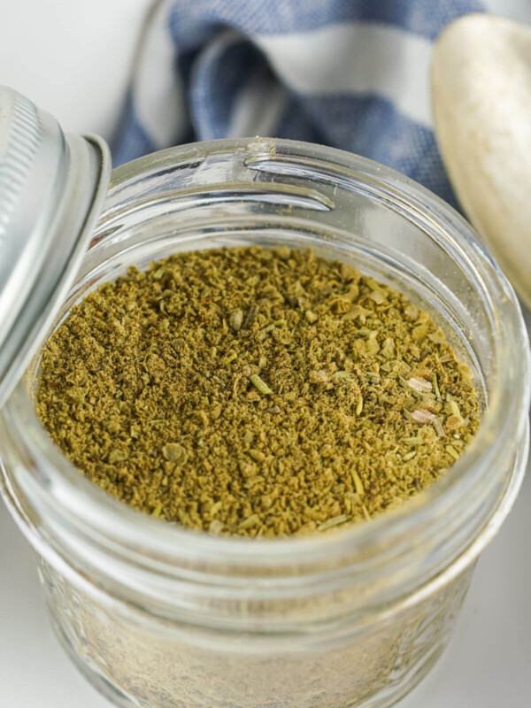 Homemade poultry seasoning in a mason jar.